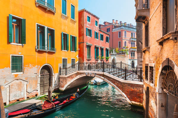 Beautiful canal in Venice, Italy. Beautiful canal with old medieval architecture and bridge in Venice, Italy. Famous travel destination gondola traditional boat photos stock pictures, royalty-free photos & images