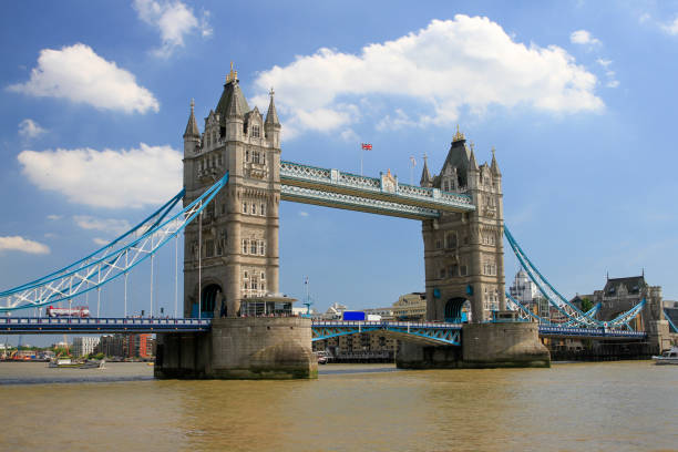 istock Tower Bridge over Thames with blue sky and clouds 1315294435
