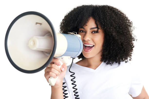 istock Studio shot of an attractive young woman using a megaphone against a white background 1315297433