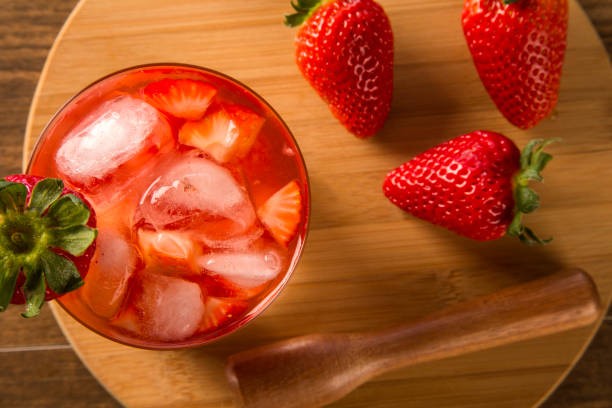 istock Fresh made Strawberry Caipirinha on wooden background 1315298119