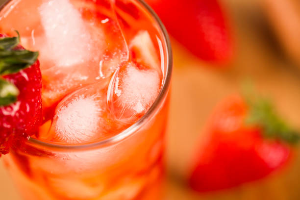 istock Fresh made Strawberry Caipirinha on wooden background 1315298372
