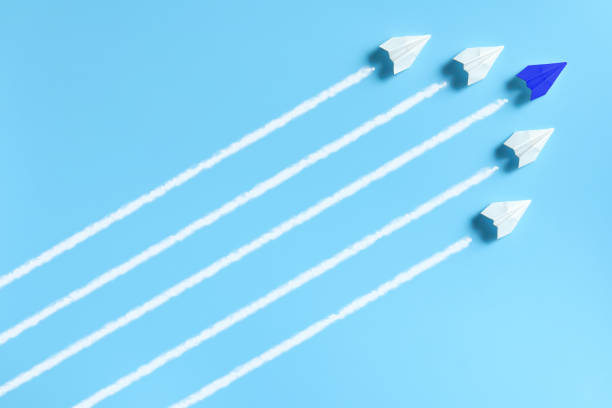 istock Five paper planes flying in formation. 1315298883