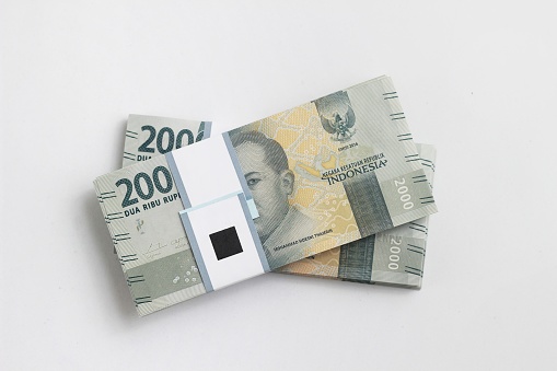 flat lay, stack of bundle 2000 Rupiah Indonesia Money, at White Background