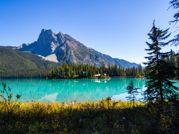 istock view of a turquoise lake and mountain peak behind 1315299033