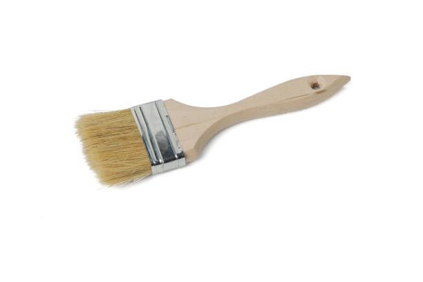 istock Rough paint brush with wooden handle isolated on white background. 1315299066