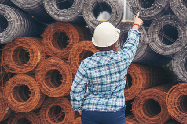 istock Woman construction engineer wear safety white hard hat at construction site industry worker. Female engineer worker civil engineering with hard hat safety helmet. Woman construction Engineer concept 1315299151
