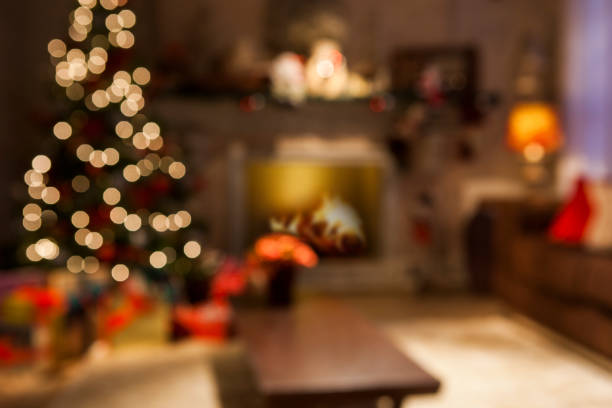istock Christmas scene with tree gifts and fire in background 1315299932