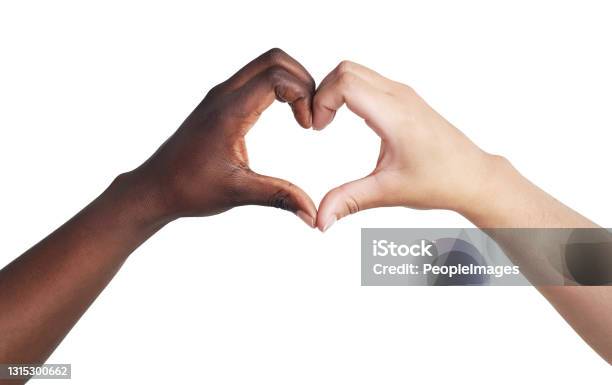 Studio Shot Of Two Unrecognisable Women Joining Their Hands To Make A Heart Shape Against A White Background Stock Photo - Download Image Now