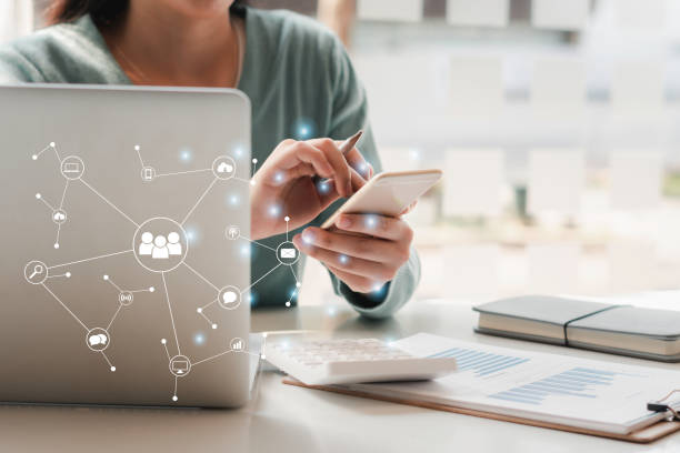 istock Young woman's hand is using a smartphone to play social media, a mobile phone with a notification icon,Social Distancing ,Working From Home concept. 1315302330