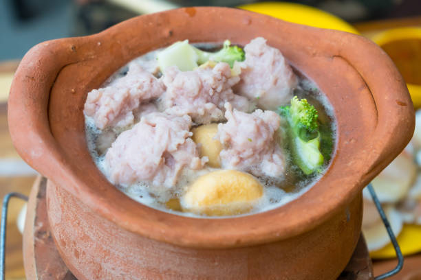 view of pork meat with chopsticks over hot pot and vegetables for shabu.Asian food concept.Slective focus. view of pork meat with chopsticks over hot pot and vegetables for shabu.Asian food concept.Slective focus. Slective Focus stock pictures, royalty-free photos & images