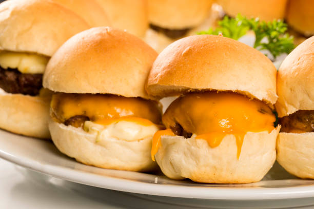 istock Mini hamburger serving with cheese and salad. 1315306783