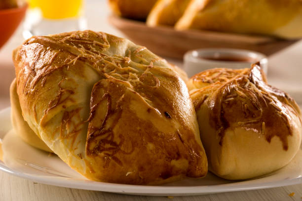 istock Brazilian snack fried with cheese ham on wooden background. 1315309982