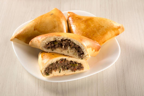 istock Brazilian snack. Meat Esfiha on the table 1315310005