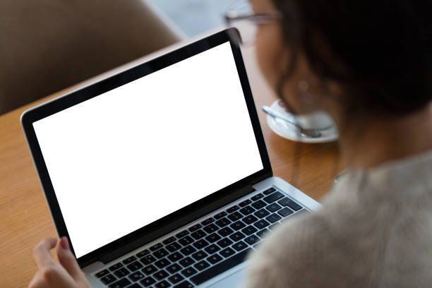 istock Young woman using blank white screen laptop 1315312577