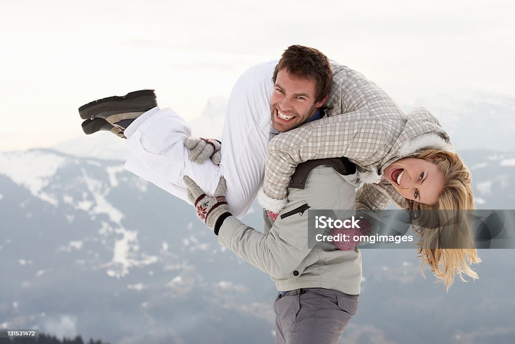 Young Couple On Winter Vacation Young Couple On Winter Vacation smiling to camera 20-29 Years Stock Photo