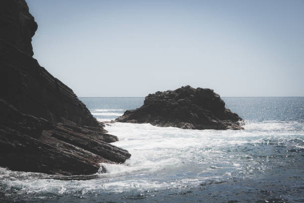 istock Waves on rocks on the sea 1315316423