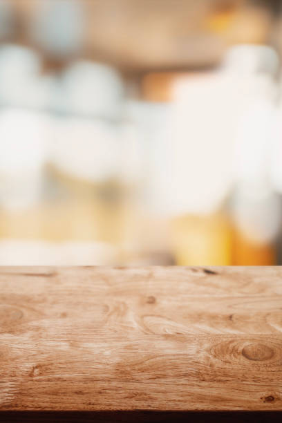 istock Empty wood table with abstract modern living room style interior background. 1315318825