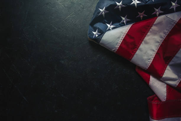 istock Flag of USA on dark concrete wall 1315319652