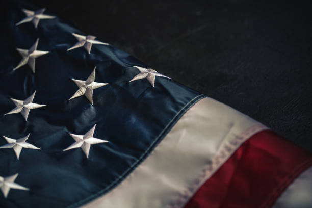 istock Flag of USA on dark background 1315319980