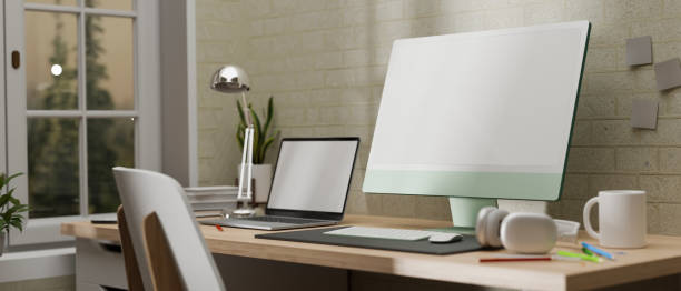 istock Side view, 3D rendering, home office room, computer desk beside the window with laptop, supplies, lamp and decoration 1315319985