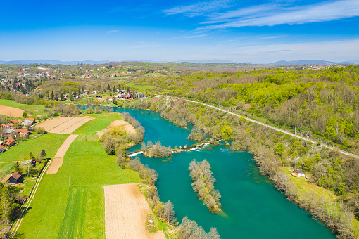 Panoramic view of countryside landscape, Mreznica river and Donji Zvecaj village from air, Croatia