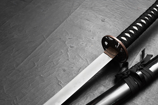 Katana sword on the black table background with copy space.