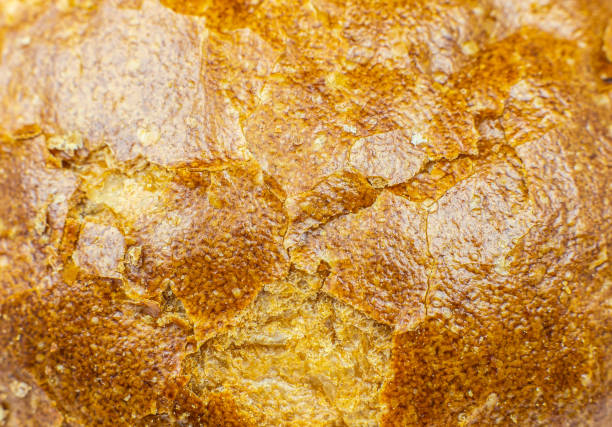 rust of bread texture background. Bakery concept. Close up, macro photo.