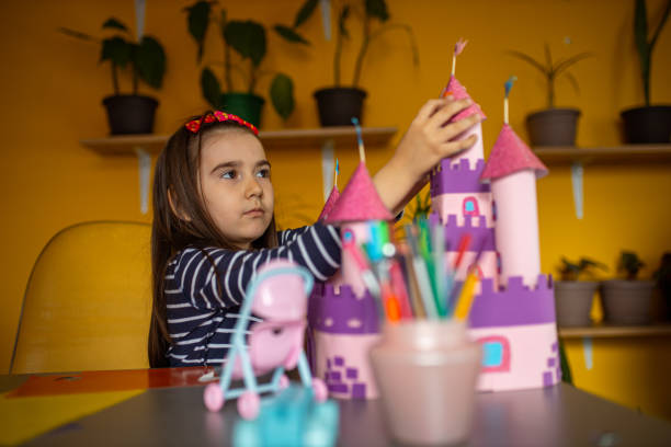 istock Little girl builds a castle 1315326728