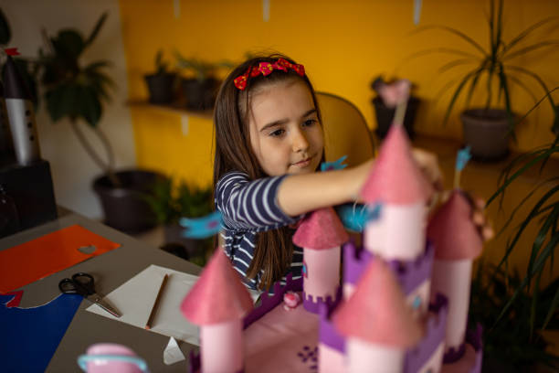 istock Little girl builds a castle 1315326730
