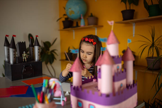 istock Little girl builds a castle 1315326733