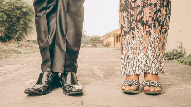 istock male and female feet pose 1315331187