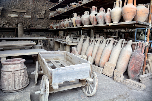 Amphoras and wooden cart obtained in Pompeii, Italy