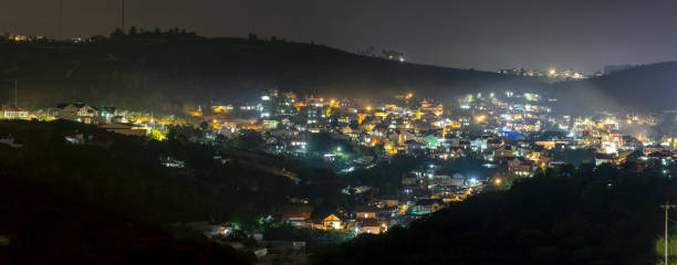 Night scene in the valley with bright houses colorful lights Night scene in the valley with bright houses colorful lights makes the night scene in the countryside more vibrant in the Da Lat plateau, Vietnam dalat photos stock pictures, royalty-free photos & images