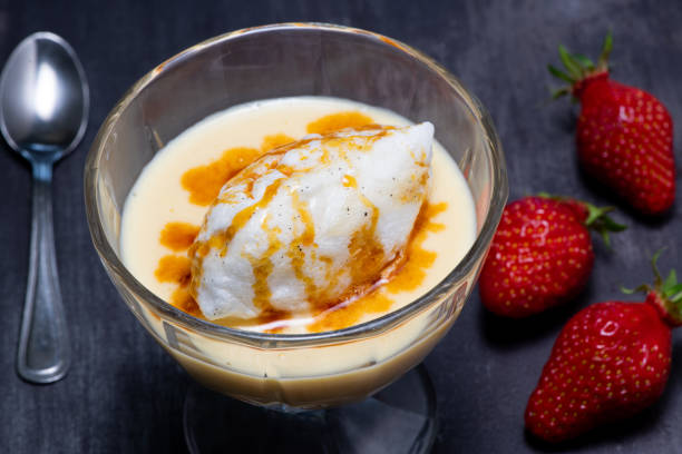 istock Snowy eggs and custard recipe on black background 1315336186