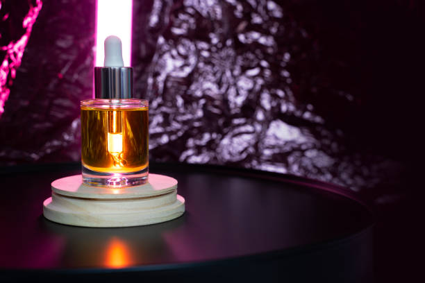 istock Face oil on a podium with tube light 1315338300
