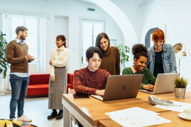 istock Wide Angle photo of multi-ethnic people in shared office after vaccination 1315339425