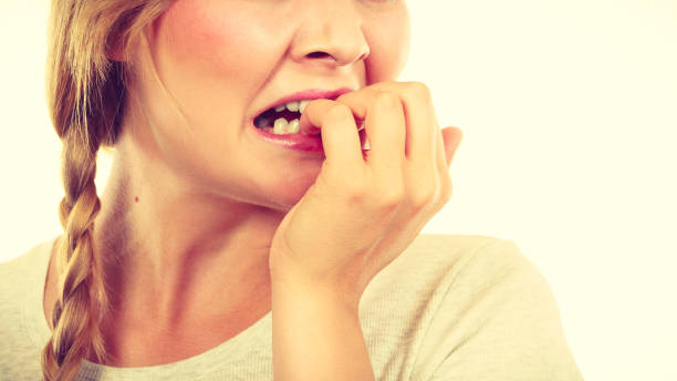 istock Scared, stressed woman biting her nails 1315339858