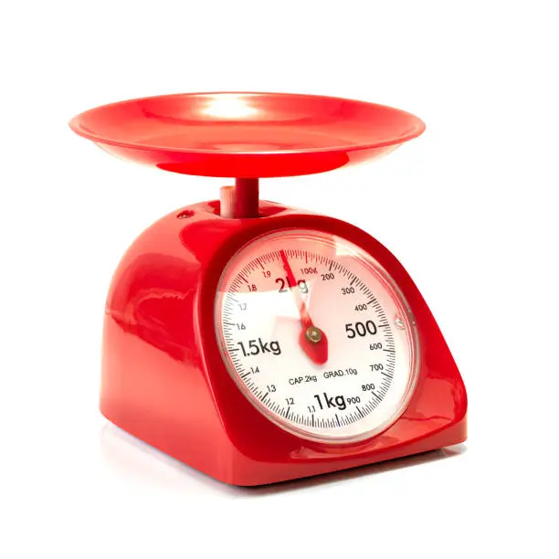Red kitchen scale isolated on white background with clipping path