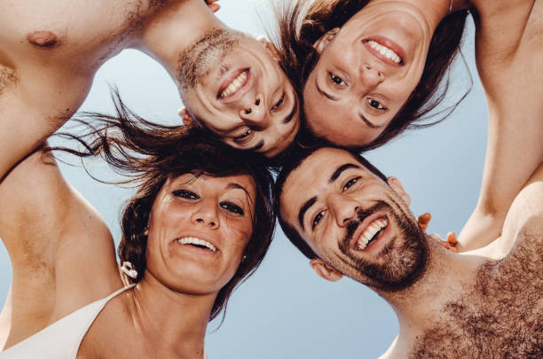 istock low angle view of happiness friends at the beach 1315340138