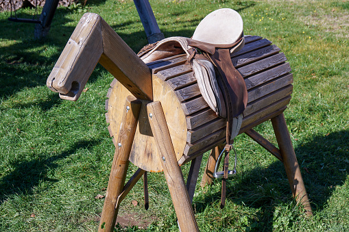 wooden horse with saddle for children