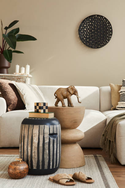 istock Modern concept of mediterranean interior with design sofa, wooden stool, coffee table, pillow, blanket, decoration, plant and personal accessories in stylish home decor. Template. 1315342134