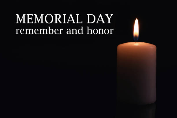 istock Memorial day. Wax candle burning on black background 1315342528
