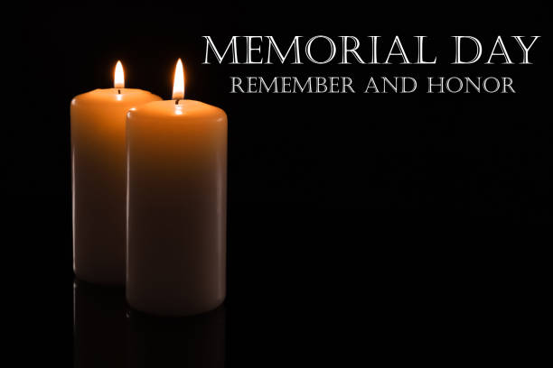 istock Memorial day. Wax candles burning on black background 1315342604