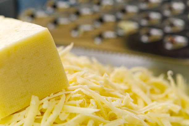 istock Cheese and Grated cheese, close-up. blurred background 1315345907