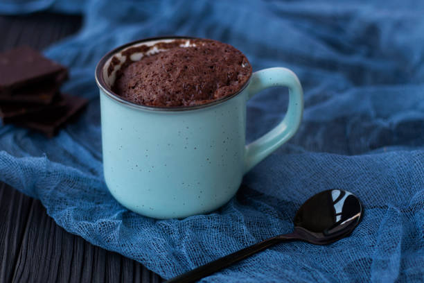 istock a chocolate cupcake in a mug is cooked in the microwave. 1315349732