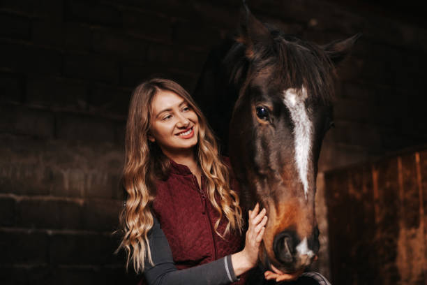 istock Young woman bonding with her horse 1315351342