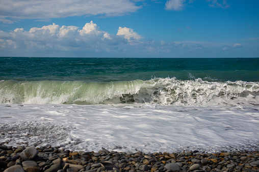 Deep sea water waves. Pebble beach on the Black Sea coast