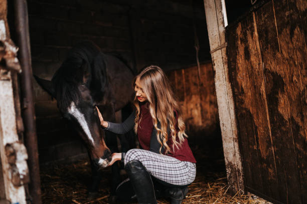 istock Young woman bonding with her horse 1315351626