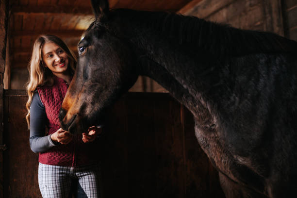 istock Young woman bonding with her horse 1315352078