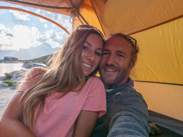 istock Couple take selfie inside a tent, camping weekend 1315352381